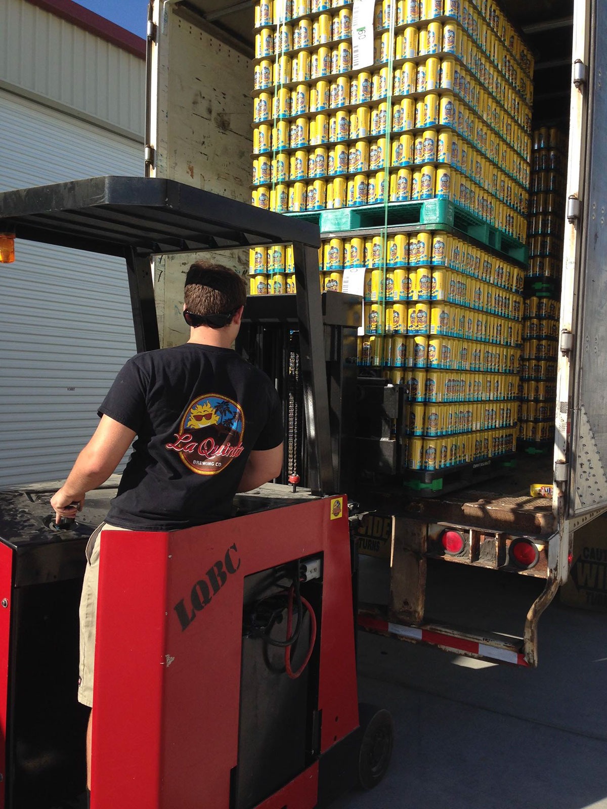 Forklift getting cans